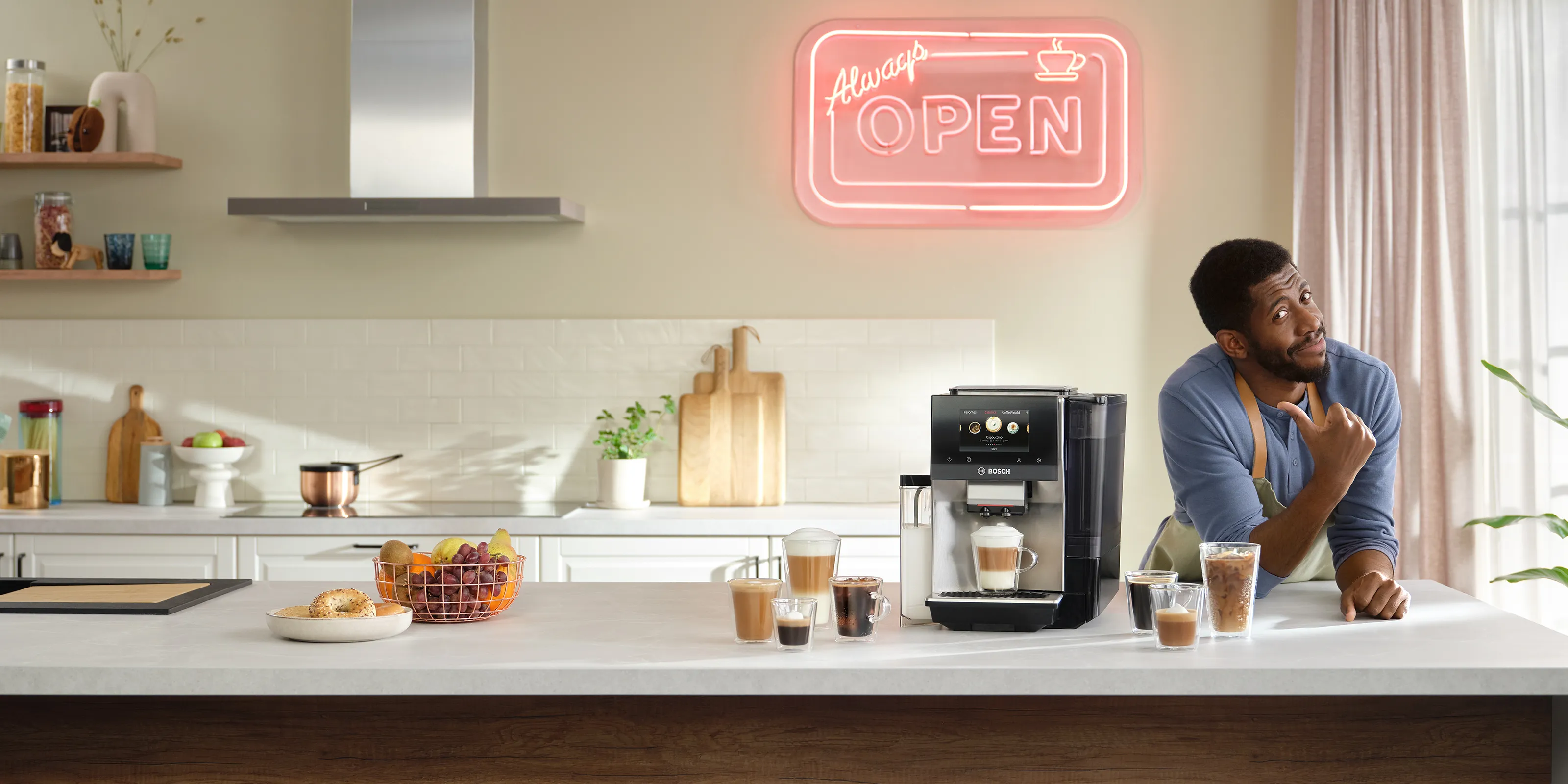 Brew it like a Bosch campaign: a home barista beside a VeroCafé machine and an Always Open neon sign
